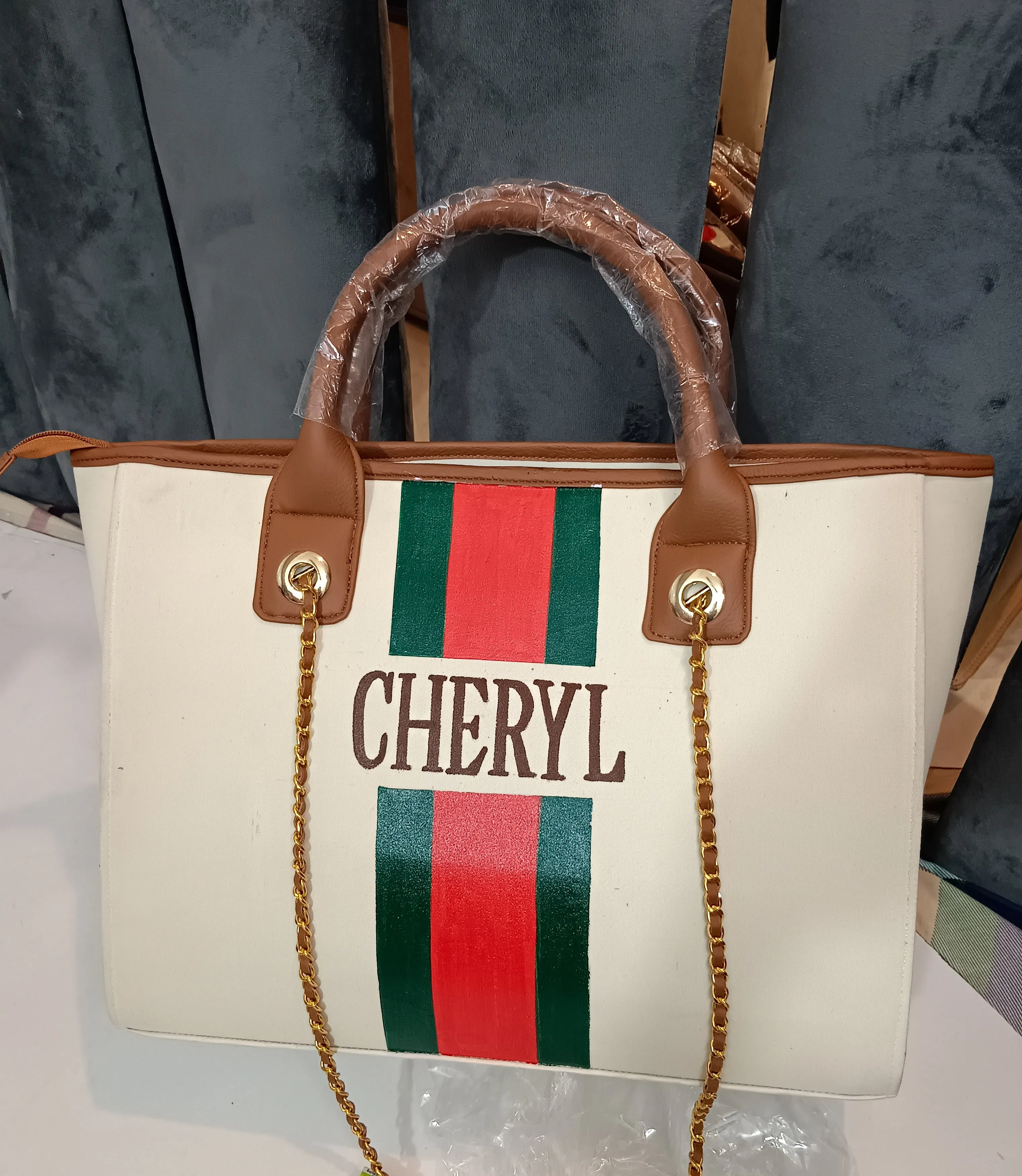 Off-white bag with green and red stripes